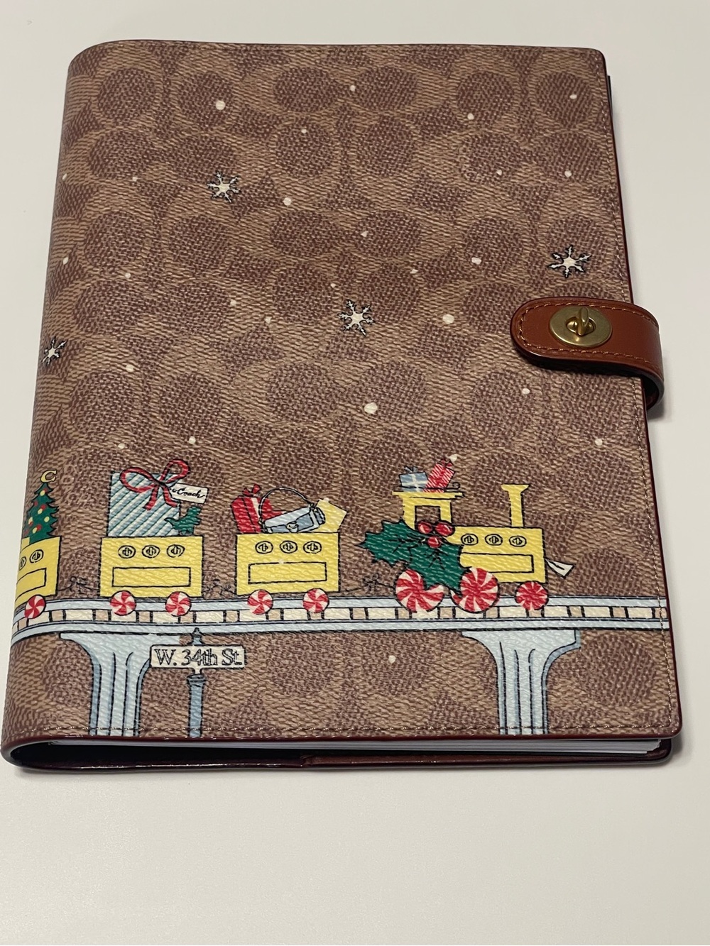 Coach Retail- Holiday Train Signature Notebook. 2025 edition   New